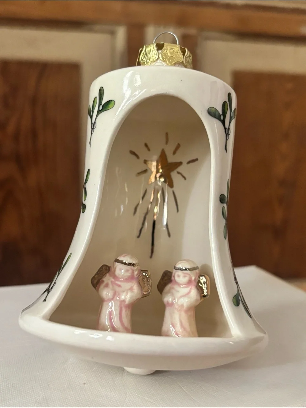 White Ceramic Bell Ornament with Pink Angel Figurines